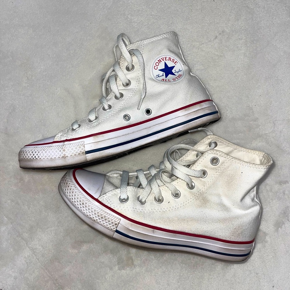 All white Chuck Taylor high top Converse All Stars women’s 7 men’s 5